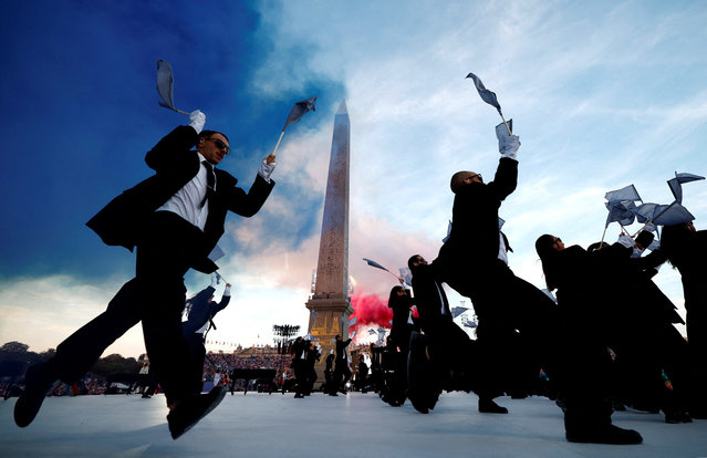 Dancers performs in front of the Obelisque de Louxor (Luxor Obelisk) at the Place de la Concorde during the Paris 2024 Paralympic Games Opening Ceremony in Paris on August 28, 2024. (Photo by Gonzalo Fuentes/Reuters)
