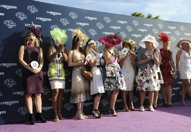 Valerie Netherton, left, of Louisville, KY, reacts after winning the Longines Prize of Elegance contest at the 2016 Breeders' Cup, Friday, November 4, 2016, at Santa Anita Park in Arcadia, CA. Longines, the Swiss watch manufacturer known for its elegant timepieces, is the Official Watch and Timekeeper of the Breeders' Cup World Championships and the Triple Crown. (Photo by Diane Bondareff/Invision for Longines/AP Images)