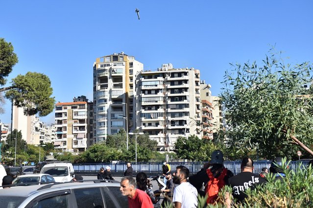 A rocket fired by an Israeli war plane targets a building in Beirut's southern suburb of Shayah on October 22, 2024, amid the ongoing war between Israel and Hezbollah. (Photo by Fadel Itani/AFP Photo)