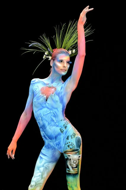 A participant poses with her body paintings designed by bodypainting artist Melanie Hill during the 16th World Bodypainting Festival in Poertschach on July 6, 2013 in Poertschach am Woerthersee, Austria. (Photo by Didier Messens/Getty Images)