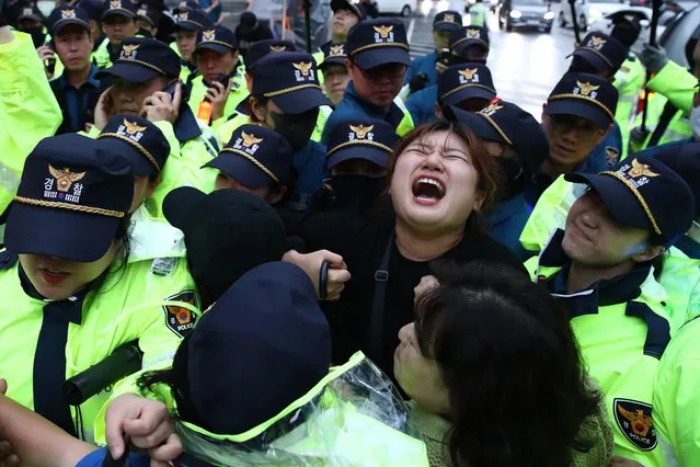 South Korean protesters scuffle with police during a rally against Japanese government's decision to release treated radioactive water into the Pacific Ocean, on August 22, 2023 in Seoul, South Korea. Japanese Prime Minister Fumio Kishida said that Japan will begin to discharge treated radioactive water from its crippled Fukushima nuclear power plant August 24, despite lingering safety concerns. (Photo by Chung Sung-Jun/Getty Images)