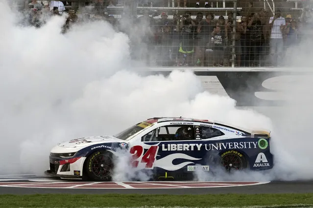 William Byron (24) burns his tires after winning the NASCAR Cup Series auto race at Texas Motor Speedway in Fort Worth, Texas, Sunday, September 24, 2023. (Photo by L.M. Otero/AP Photo)