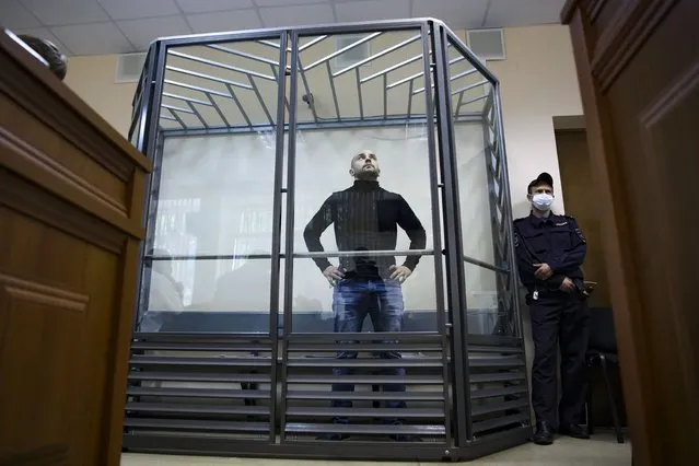 Andrei Pivovarov, the head of Open Russia movement stands behind the glass during a court session in Krasnodar, Russia, Wednesday, June 2, 2021. In the southern city of Krasnodar, a court was scheduled to consider whether to keep Andrei Pivovarov, the head of the Open Russia movement, in custody pending an investigation. Pivovarov was pulled off a Warsaw-bound plane at St. Petersburg's airport just before takeoff late Monday and taken to Krasnodar, where authorities accused him of supporting a local election candidate last year on behalf of an “undesirable” organization. (Photo by AP Photo/Stringer)