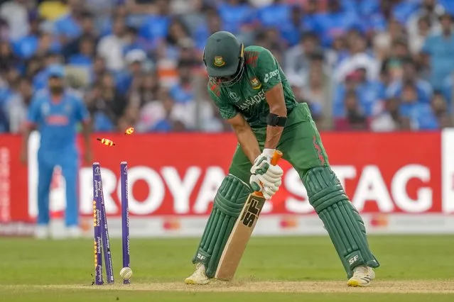 Bangladesh's Mahmudullah Riyad bowled out by India's Jasprit Bumrah during the ICC Men's Cricket World Cup match between India and Bangladesh in Pune, India, Thursday, October 19, 2023. (Photo by Rafiq Maqbool/AP Photo)