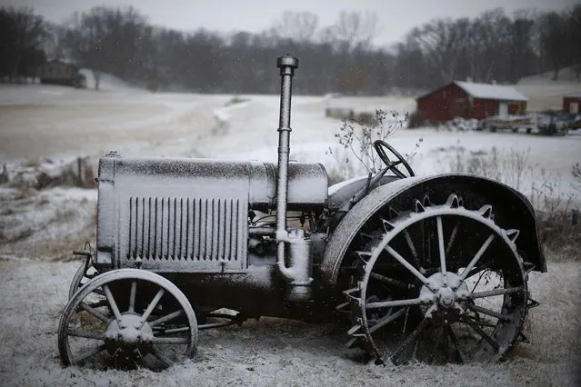 A snow covered tractor is seen near Mt. Vernon, Iowa, January 25, 2015. 2015. (Photo by Jim Young/Reuters)