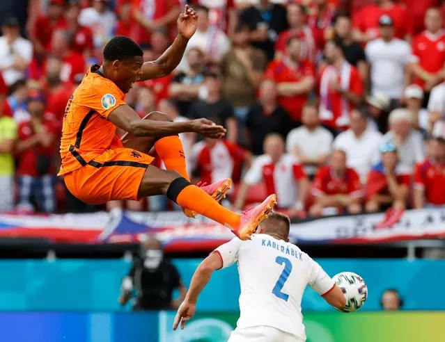 Czech Republic's Pavel Kaderabek, right, challenges Denzel Dumfries of the Netherlands during the Euro 2020 soccer championship round of 16 match between Netherlands and Czech Republic at the Ferenc Puskas stadium in Budapest, Hungary, Sunday, June 27, 2021. (Photo by Bernadet Szabo/Pool via AP Photo)