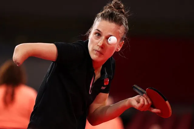 Poland's Natalia Partyka serves to Australia's Michelle Bromley during their women's singles round 1 table tennis match at the Tokyo Metropolitan Gymnasium during the Tokyo 2020 Olympic Games in Tokyo on July 24, 2021. (Photo by Thomas Peter/Reuters)