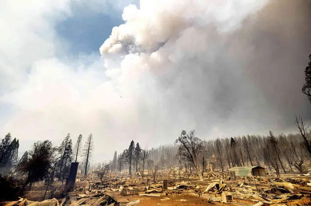 This photo shows homes destroyed by the Dixie Fire line central Greenville on Thursday, August 5, 2021, in Plumas County, Calif. (Photo by Noah Berger/AP Photo)