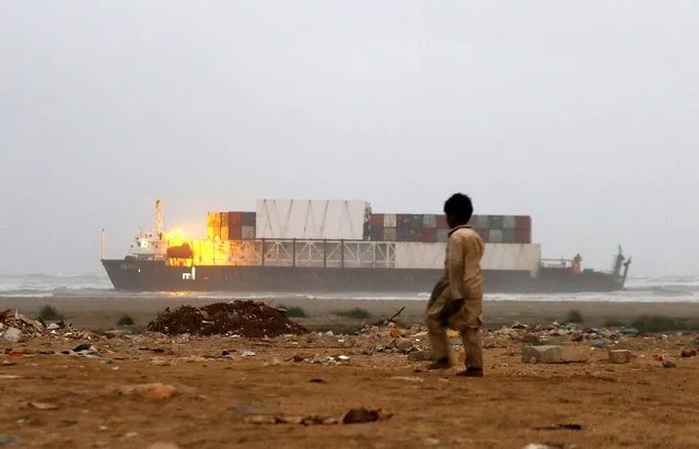 The MV Heng Tong cargo ship is stranded on Sea View beach, in Karachi, Pakistan, 22 July 2021. According to the Karachi Port Trust (KPT), MV Heng Tong, a cargo ship coming from Shanghai was on its way to Istanbul, Turkey, as it lost its anchors due to rough weather and has been stranded reached in shallow waters. (Photo by Shahzaib Akber/EPA/EFE)