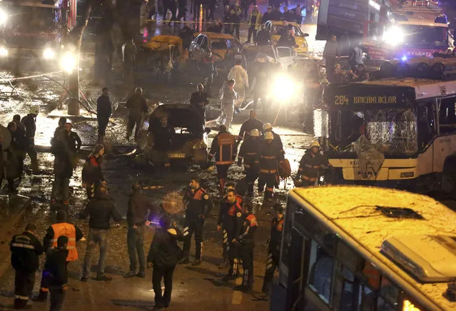 Members of emergency services work at the scene of an explosion in Ankara, Turkey, Sunday, March 13, 2016. (Photo by Riza Ozel/ Hurriyet Daily via AP Photo)