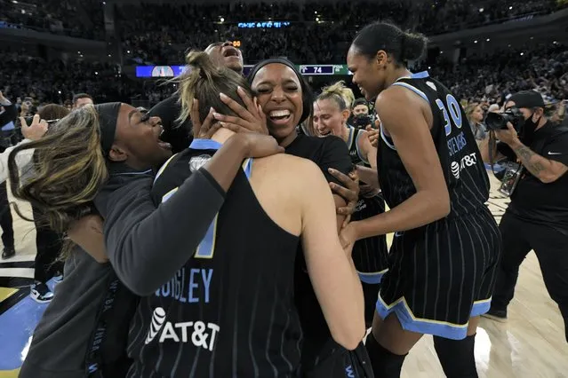 Chicago Sky players celebrate after defeating the Phoenix Mercury in Game 4 of the WNBA Finals to become champions Sunday, October 17, 2021, in Chicago. (Photo by Paul Beaty/AP Photo)