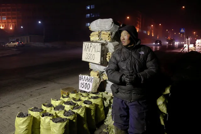 Bags of coal and wood are offered for sale in central Ulaanbaatar, Mongolia January 26, 2017. (Photo by B. Rentsendorj/Reuters)