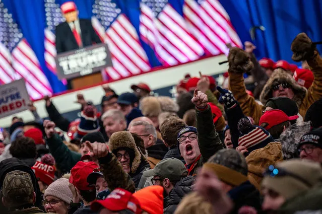 Attendees yell toward the media as former President Donald J. Trump speaks during a Get Out the Vote Rally and campaign event at the Elite Jet Center in Waterford Township, Michigan, USA, 17 February 2024. Trump is running against former South Carolina Governor Nikki Haley in the Republican presidential primary. (Photo by Tess Crowley/EPA/EFE)