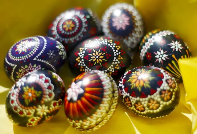 Easter eggs adorned in traditional Sorbian style are seen in Schleife, about 160 kilometers (99.4 miles) south-east of Berlin, Germany, March 27, 2016. A tiny Slavic minority in Germany is keeping alive a long and intricate tradition of hand-painting Easter eggs with the help of feathers and wax. (Photo by Hannibal Hanschke/Reuters)