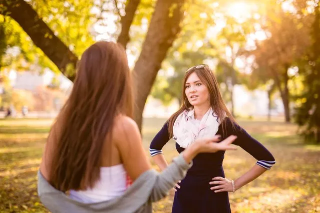 Two young Caucasian women arguing in a public park in Serbia. (Photo by urbazon/Getty Images)