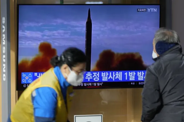 People stand near a TV screen showing a news program reporting about North Korea's missile with file footage at a train station in Seoul, South Korea, Wednesday, January 5, 2022. North Korea fired a suspected ballistic missile into the sea on Wednesday, the South Korean and Japanese militaries said, its first public weapons launch in about two months and a signal that Pyongyang isn't interested in rejoining denuclearization talks anytime soon and would rather focus on boosting its weapons arsenal. (Photo by Lee Jin-man/AP Photo)