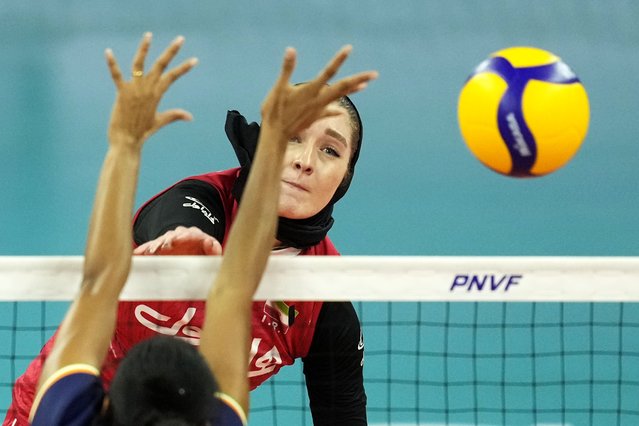 Iran's Aytak Salamatgharamaleki hits the ball against India's team during the Asian Women's Volleyball Challenge Cup in Manila, Philippines on Wednesday, May 22, 2024. (Photo by Aaron Favila/AP Photo)