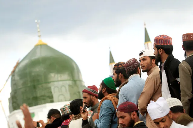 Men attend a gathering to mark the anniversary of Mumtaz Qadri death next to the shrine built over his grave outside Islamabad, Pakistan, March 1, 2017. (Photo by Faisal Mahmood/Reuters)