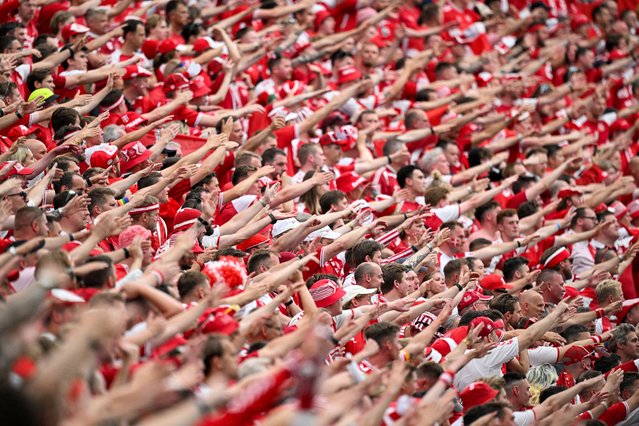 Fans of Denmark cheer on during the UEFA Euro 2024 Group C football match between Denmark and England at the Frankfurt Arena in Frankfurt am Main on June 20, 2024. (Photo by Kirill Kudryavtsev/AFP Photo)