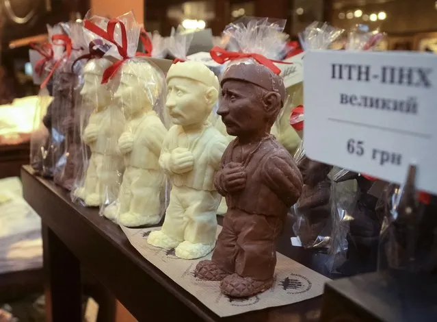 Chocolate in the form of Russian President Vladimir Putin is displayed at Lviv Chocolate Studio in Lviv, Ukraine, on May 15, 2014. The store produces and sells handmade chocolate moulded to resemble the Russian president dressed in the outfit of a prisoner. Each piece costs around $6. (Photo by Roman Baluk/Reuters)