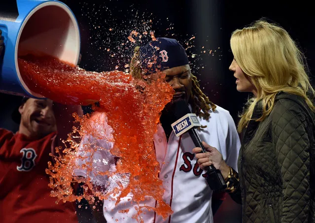 May 2, 2017; Boston, MA, USA; Boston Red Sox designated hitter Hanley Ramirez (13) its splashed with Gatorade during an interview with NESN reporter Guerin Austin after defeating the Baltimore Orioles at Fenway Park. (Photo by Bob DeChiara/USA TODAY Sports)