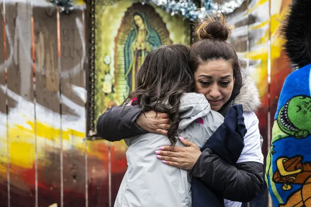 Elizabeth Toledo hugs a supporter during a vigil and news conference on the one-year anniversary of her son, 13-year-old Adam Toledo, being fatally shot by a Chicago police officer during a foot pursuit, Tuesday, March 29, 2022, in Chicago. (Photo by Ashlee Rezin/Chicago Sun-Times via AP Photo)
