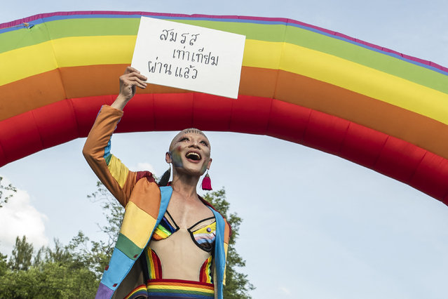 A member of the LGBTQ community celebrates after the Thai parliament passed the final senatorial vote on the same s*x marriage bill, at Government House in Bangkok on June 18, 2024. Thailand on June 18 became the first country in Southeast Asia to legalise same-s*x marriage, in a historic parliamentary vote hailed as a “victory” by campaigners. (Photo by Chanakarn Laosarakham/AFP Photo)