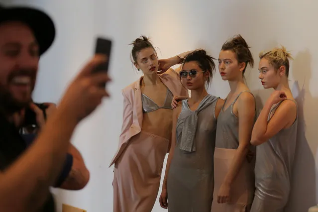 Models for designer Gary Bigeni pose backstage during Fashion Week Australia in Sydney on May 16, 2017. (Photo by Steven Saphore/Reuters)