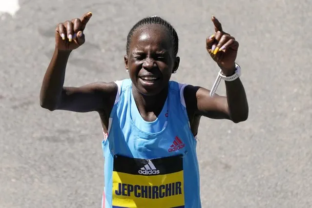 Peres Jepchirchir, of Kenya, reacts after winning the women's division of the Boston Marathon, Monday, April 18, 2022, in Boston. (Photo by Charles Krupa/AP Photo)