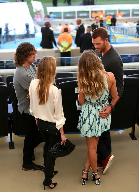 (L-R) Former Spanish international Carles Puyol, Vanessa Lorenzo, model Gisele Bundchen and NFL athlete Tom Brady look on prior to the 2014 FIFA World Cup Brazil Final match between Germany and Argentina at Maracana on July 13, 2014 in Rio de Janeiro, Brazil.  (Photo by Jamie Squire/Getty Images)