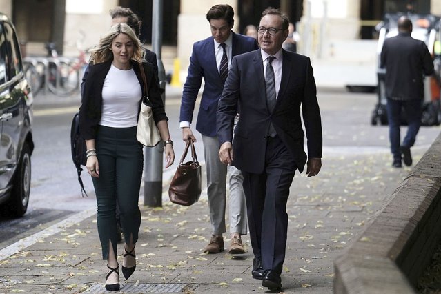 Actor Kevin Spacey, right, arrives at Southwark Crown Court where he is accused of sexual offenses against four men in Britain, in London, Wednesday, July 5, 2023. The actor, charged under his full name of Kevin Spacey Fowler, has pleaded not guilty to all 12 counts, which relate to alleged incidents between 2001 and 2013. (Photo by Jordan Pettitt/PA Wire via AP Photo)