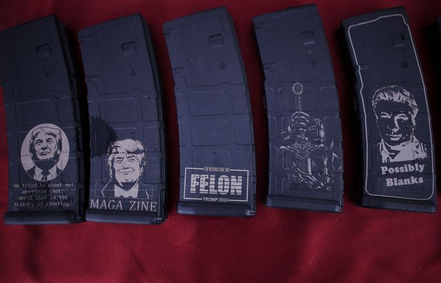 Thirty-round AR-15 magazines, some commemorating Donald Trump, are displayed for sale at the Coat of Arms vendor booth at the Rod of Iron Freedom Festival, in Greeley, Pennsylvania, on October 13, 2024. (Photo by Brian Snyder/Reuters)