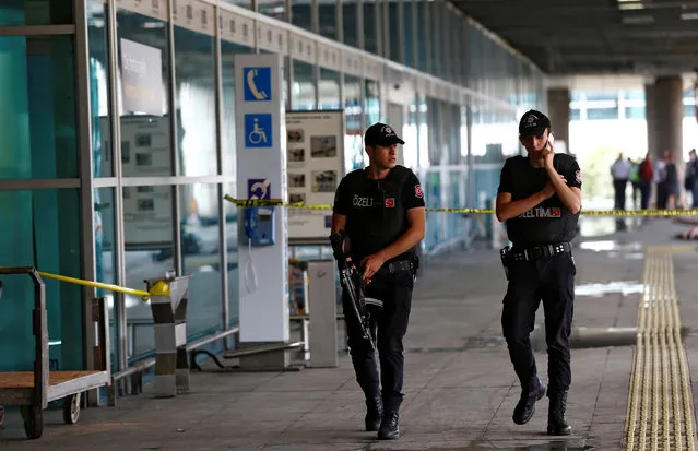 Police officers patrol at Turkey's largest airport, Istanbul Ataturk, following yesterday's blast June 29, 2016. (Photo by Osman Orsal/Reuters)