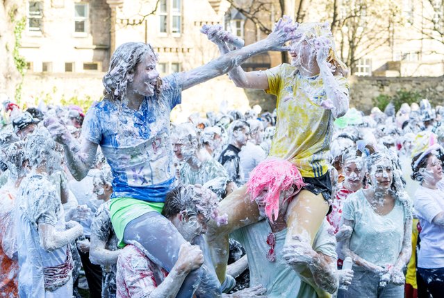 Students from St Andrews University are covered in foam as they leave after taking part in the traditional “Raisin Weekend” in the Lower College Lawn, at St Andrews in Scotland, Britain, on October 21, 2024. (Photo by Lesley Martin/Reuters)