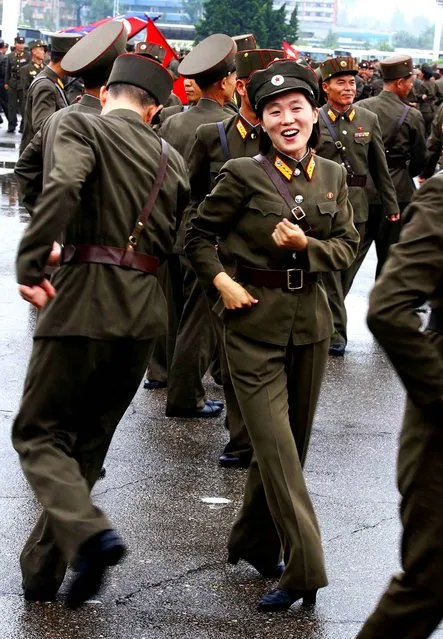 North Korean soldiers dance in the plazas of Pyongyang after the country announced that leader Kim Jong Un was granted the title of marshal, a move that cements his status at the top of the nation s military as he makes key changes to the 1.2 million-man force on July 18, 2012.  (Photo by Kim Kwang Hyon/Associated Press)