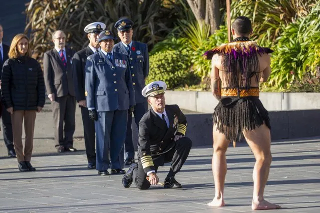 Admiral John Aquilino, commander of U.S. Indo-Pacific Command, accepts the challenge by Maori warriors during his powhiri (welcome) to the Pukeahu National War Memorial Park in Wellington, New Zealand, Monday, August 1, 2022. Admiral Aquilino is visiting Wellington as the U.S. is looking to increase its presence in the region amid deep concerns over China's growing ambitions in the Pacific. (Photo by Mark Mitchell/New Zealand Herald via AP Photo)