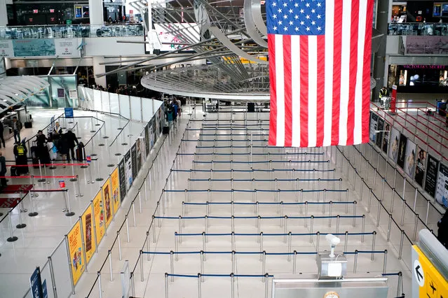 The lines to reach TSA immigration process are seen empty at one of its terminals at the John F. Kennedy International Airport in New York, U.S., March 9, 2020. (Photo by Eduardo Munoz/Reuters)