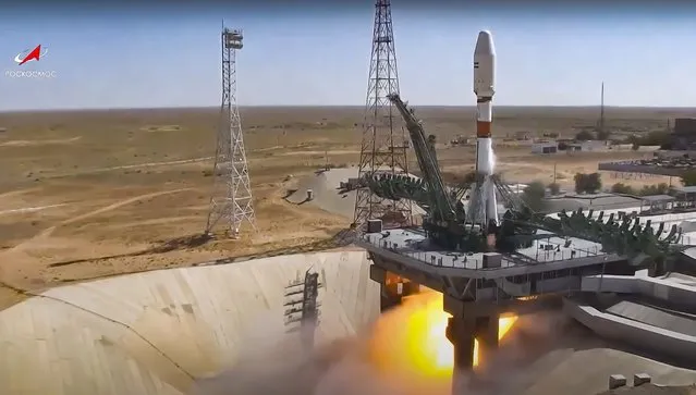In this handout photo taken from video released by Roscosmos on Tuesday, August 9, 2022, a Russian Soyuz rocket lifts off to carry Iranian Khayyam satellite into orbit at the Russian leased Baikonur cosmodrome near Baikonur, Kazakhstan. A Russian rocket has successfully launched an Iranian satellite into orbit. The Soyuz rocket lifted off as scheduled at 8:52 a.m. Moscow time (0552 GMT) Tuesday from the Russia-leased Baikonur launch facility in Kazakhstan. (Photo by Roscosmos via AP Photo)