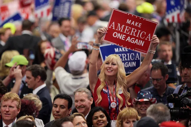 A delegate holds up sign that reads “Make America One Again” during the evening session on the fourth day of the Republican National Convention on July 21, 2016 at the Quicken Loans Arena in Cleveland, Ohio. (Photo by Jeff Swensen/Getty Images)