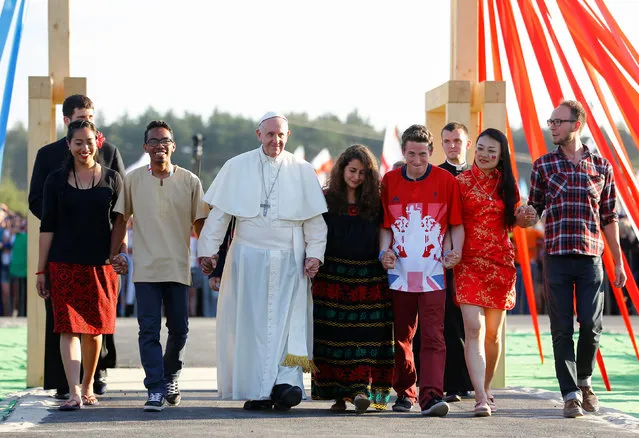 Pope Francis walks through Holy Door with youth at the Campus Misericordiae during World Youth Day in Brzegi near Krakow, Poland July 30, 2016. (Photo by Stefano Rellandini/Reuters)
