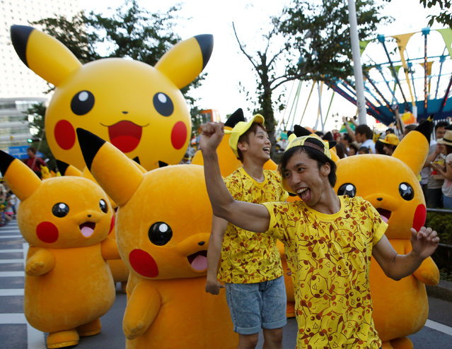 Dancers and performers wearing Pokemon's character Pikachu take part in a parade in Yokohama, Japan, August 7, 2016. (Photo by Kim Kyung-Hoon/Reuters)