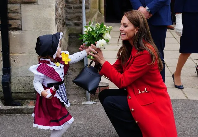 The Princess of Wales receives a posy of flowers from Charlotte Bunting, aged two, as she leaves after a visit to St Thomas Church, in Swansea, Wales on Tuesday, September 27, 2022. (Photo by Ben Birchall/PA Images via Getty Images)