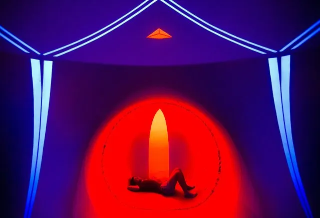 A person rests in the Luminarium Tent on the Obudai-sziget (Old Buda Island), the venue of the 24th Sziget Festival, in Budapest, Hungary, August 11, 2016. (Photo by Balaza Mohai/EPA)