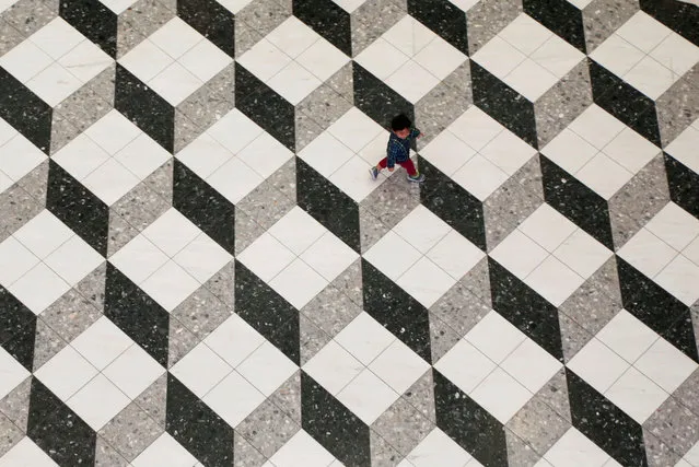 A boy walks at a shopping mall in Tokyo, Japan, October 18, 2017. (Photo by Toru Hanai/Reuters)