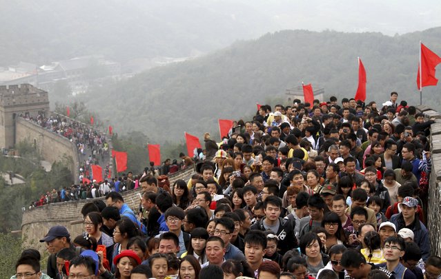 Tourists visit the Great Wall on the third day of the seven-day national day holiday, on the outskirts of Beijing, October 3, 2014. The national day holiday, known by many Chinese as “the Golden Week” for travel, started on October 1 this year, celebrating the 65th anniversary of the founding of the People's Republic of China. According to a prediction by the China Tourism Academy, a total of 480 million trips are expected to be made by travellers within these seven days, Xinhua News Agency reported. (Photo by Reuters/Stringer)
