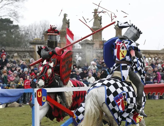 Performers dressed as medieval knights joust at Knebworth House in Hertfordshire, Britain April 1, 2013. (Photo by Olivia Harris/Reuters)