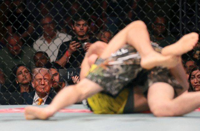 Bryce Mitchell (red gloves) fights against Jean Silva (blue gloves) as President Donald Trump watches during UFC 314 at in Miami, Florida on April 13, 2025. (Photo by Sam Navarro/Reuters)