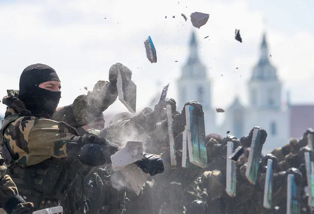 Belarusian servicemen smash tiles during an event dedicated to the 90th anniversary of the establishment of the Soviet Airborne Forces by Sports Palace on the eve of Day of Paratroopers and Special Operations Forces of Belarus in Minsk on August 1, 2020. (Photo by Natalia Fedosenko/TASS via Getty Images)