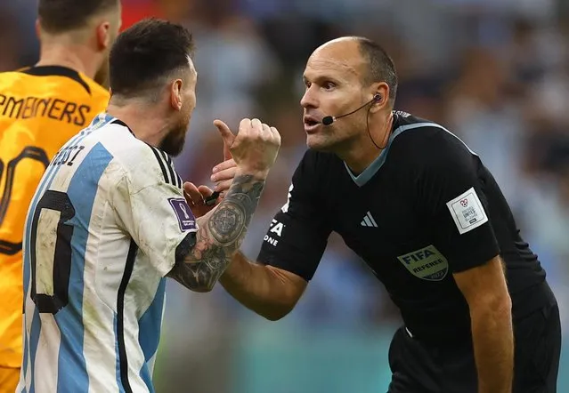 Argentina's forward #10 Lionel Messi argues with Spanish referee Antonio Mateu Lahoz during the Qatar 2022 World Cup quarter-final football match between Netherlands and Argentina at Lusail Stadium, north of Doha, on December 9, 2022. (Photo by Kai Pfaffenbach/Reuters)