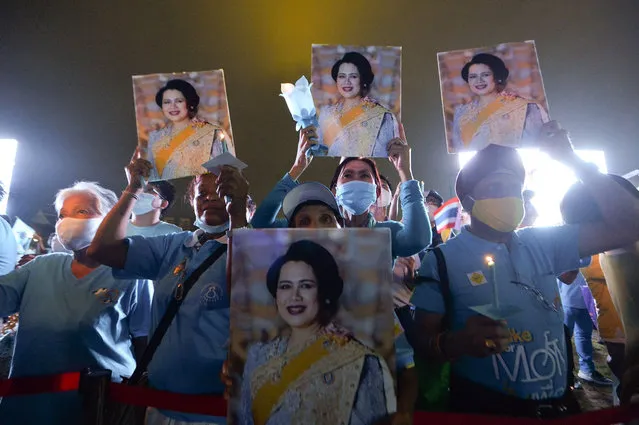People take part in an event to celebrate the 88th birthday of Sirikit, Thailand’s Queen Mother, near the Grand Palace in Bangkok, Thailand on August 13, 2020. (Photo by Xinhua News Agency/Rex Features/Shutterstock)